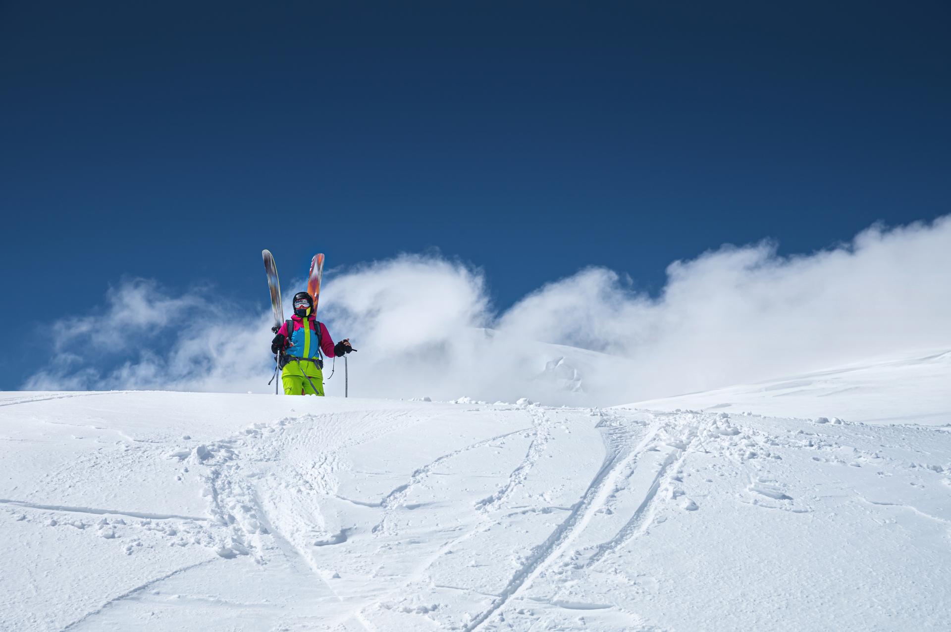 off piste skier looking at snowy slope