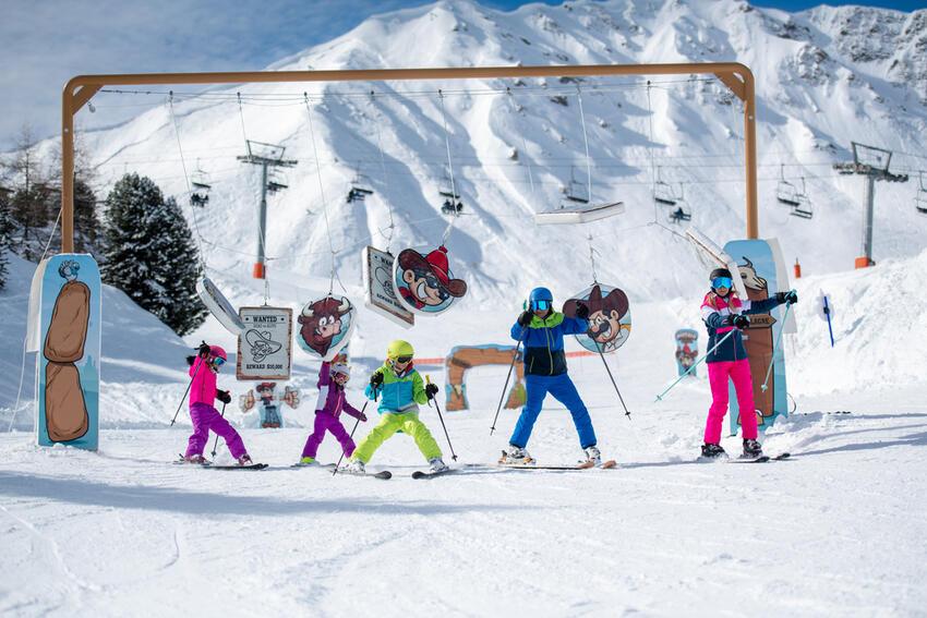 Family of skiers having fun at La Plagne ski resort