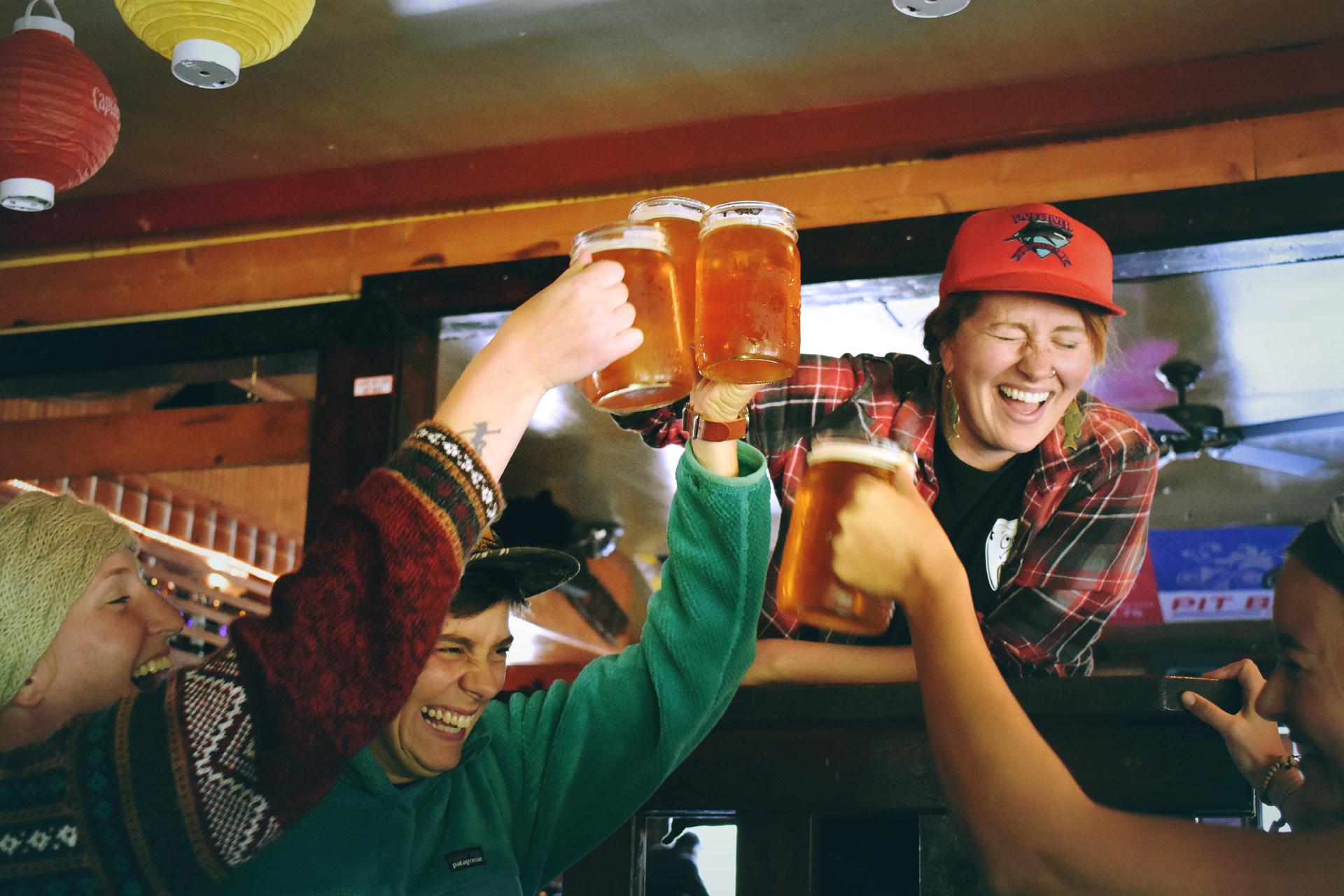 Skiers enjoying apres ski party with beers